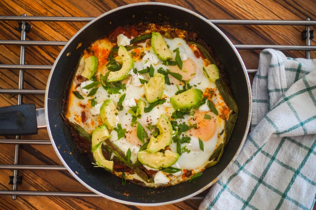 Spicy Shakshuka with Green Onion, Goat Cheese, & Avocado