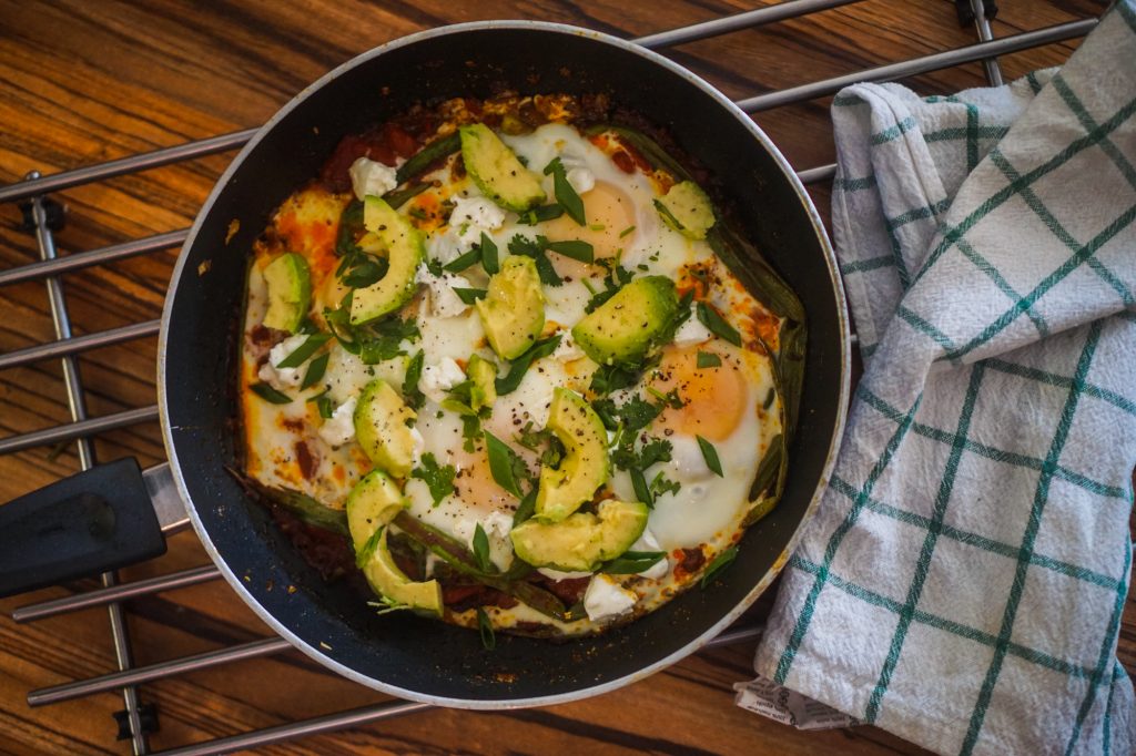 Spicy Shakshuka with Green Onion, Goat Cheese, & Avocado