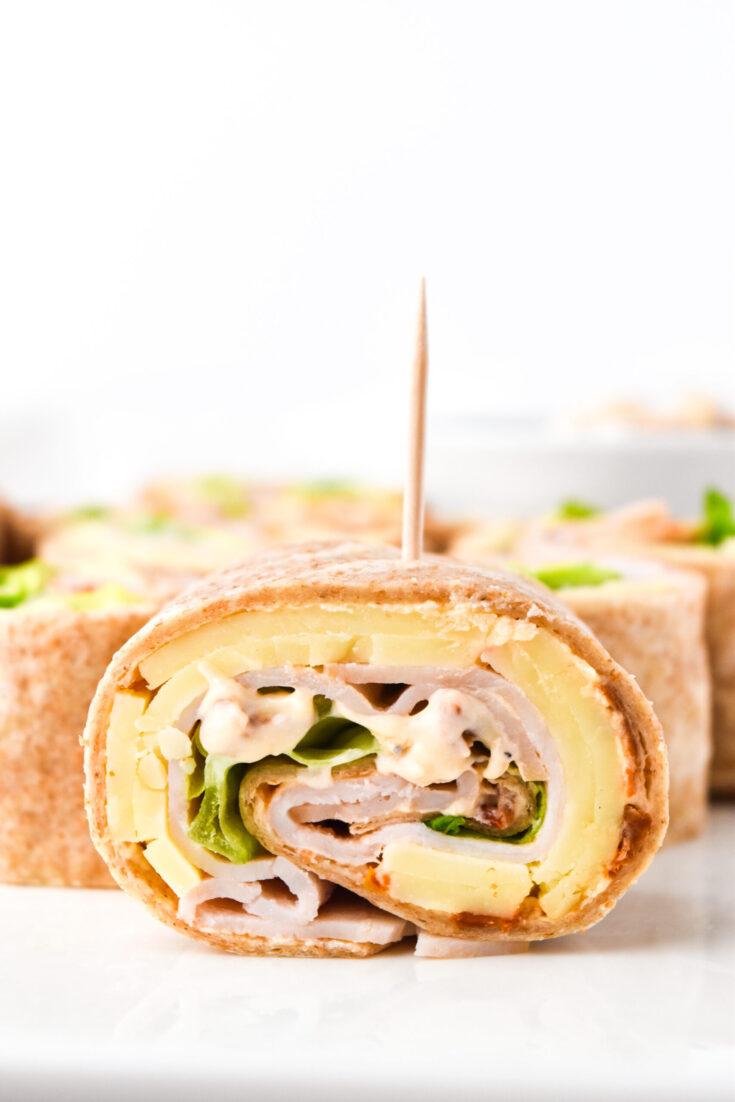 Pinwheel Sandwiches WITH SUN-DRIED TOMATO + TURKEY.