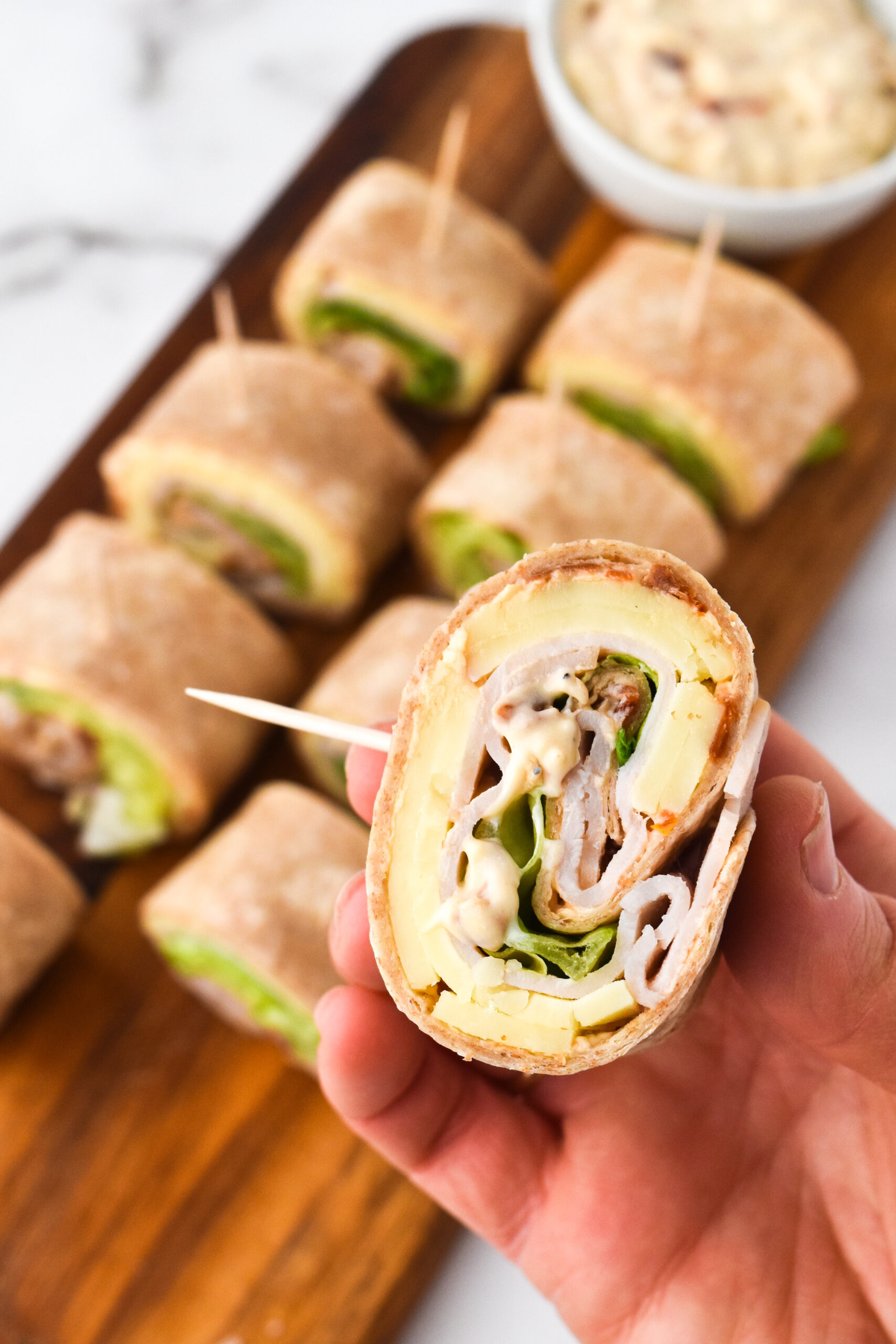 Pinwheel Sandwiches With Sun-Dried Tomato and Turkey.