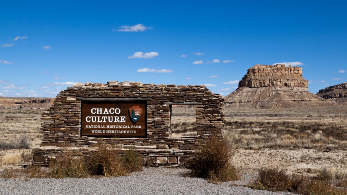 Chaco Canyon, New Mexico / USA - September 30, 2014: A wood and rock sign at the entrance of Chaco Culture National Historical Park and Heritage Site in Chaco Canyon, NM.