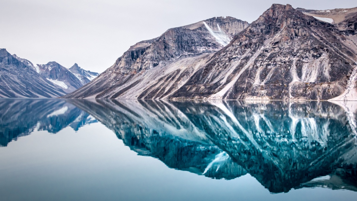 Arctic landscape, mirror mountains reflection in the calm water , Eglinton Fjord, Nunavut, Baffin bay, Canada.