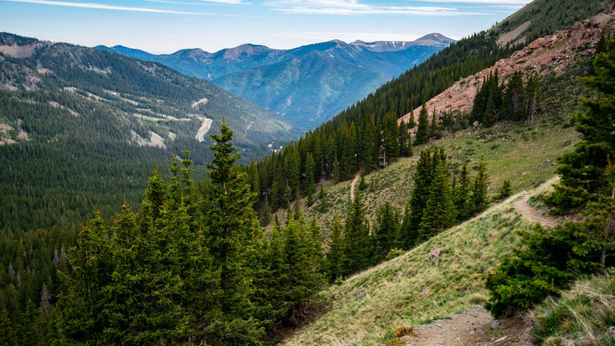 Wheeler Peak Trail in the Wilderness nature area outdoor trails and empty vast Forests , valley , and Mountain Peaks in Northern New Mexico in Taos.