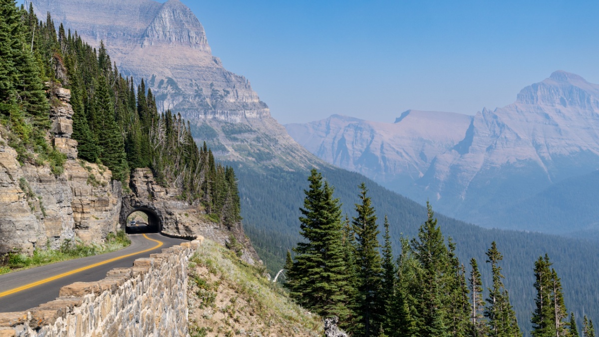 Tunnel along Going to the Sun Road in Glacier National Park on a hazy day.