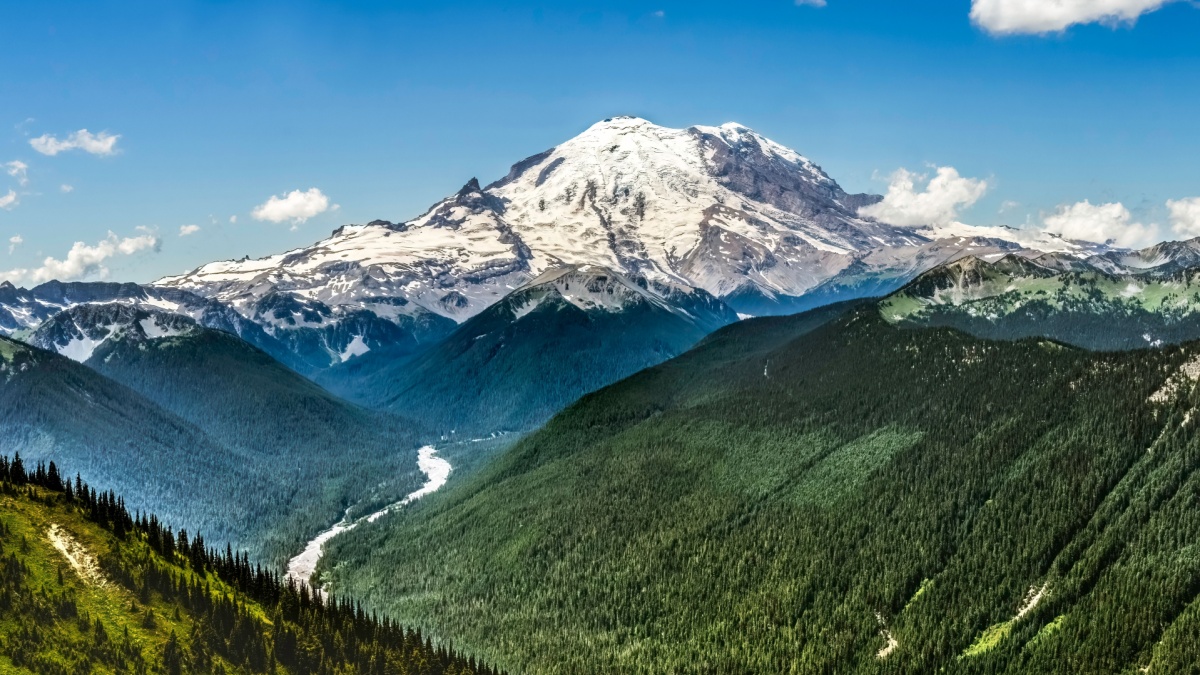 Mount Rainier White River Green Mountains Crystal Mountain Lookout Pierce County Washington. Mt Rainier over 14,000 feet, crater at top. Crystal Mountain is a Ski Resort next to Mount Rainier.