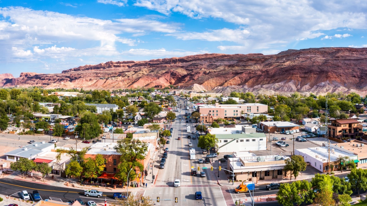 Aerial view of Moab, Utah along Main street. Moab is the largest city and county seat of Grand County in eastern Utah in the western United States, known for its dramatic scenery.