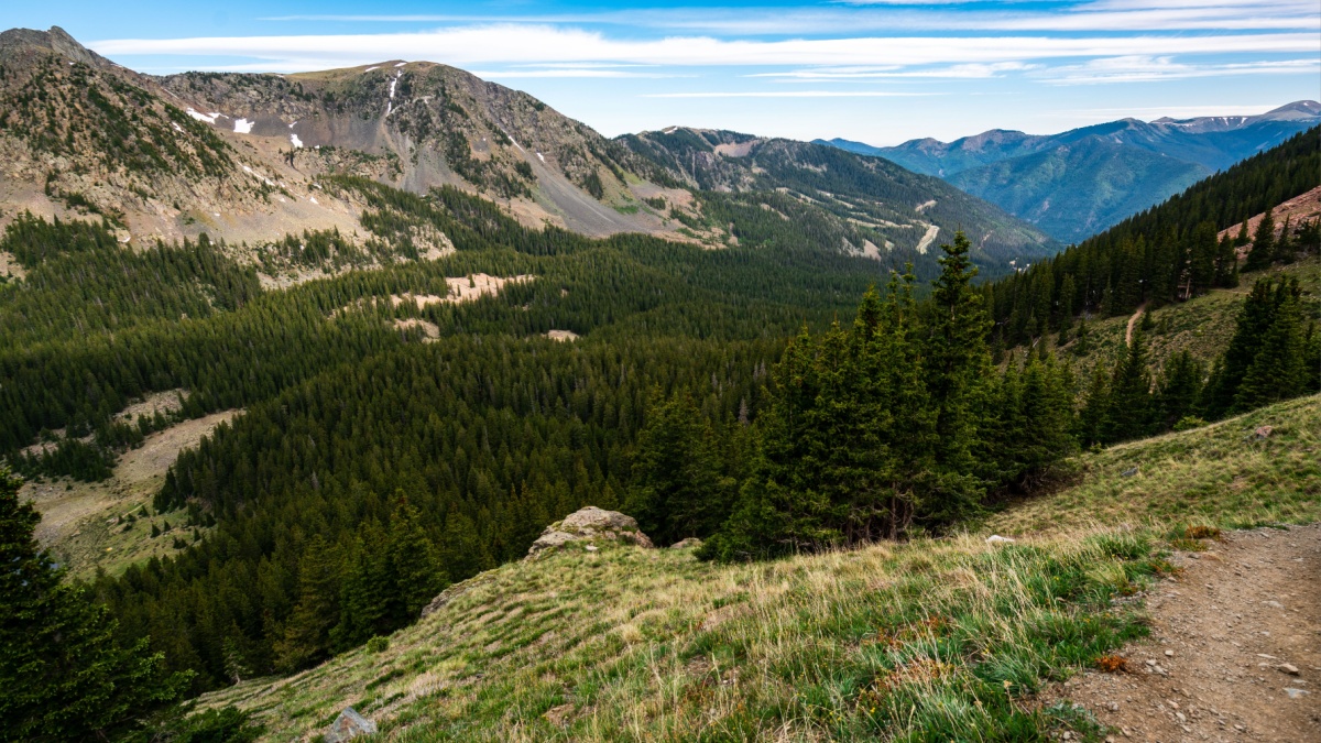 Hiking trail high in the Wheeler Wilderness nature area outdoor trails and empty vast Forests , valley , and Mountain Peaks in Northern New Mexico in Taos.