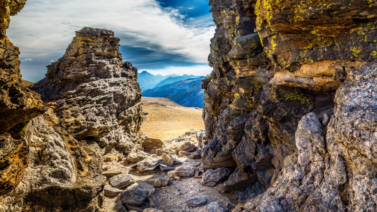 View on the Rocky Mountain National Park through rocks on the Tundra Community trail, Colorado.