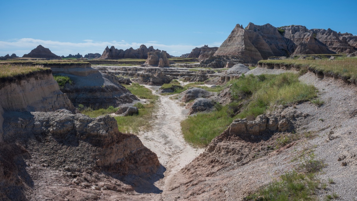 The Castle Trail at Badlands National Park in South Dakota is a 10.3-mile out-and-back desert trail that is a very popular for backpacking, camping, and hiking and is the longest in the park.