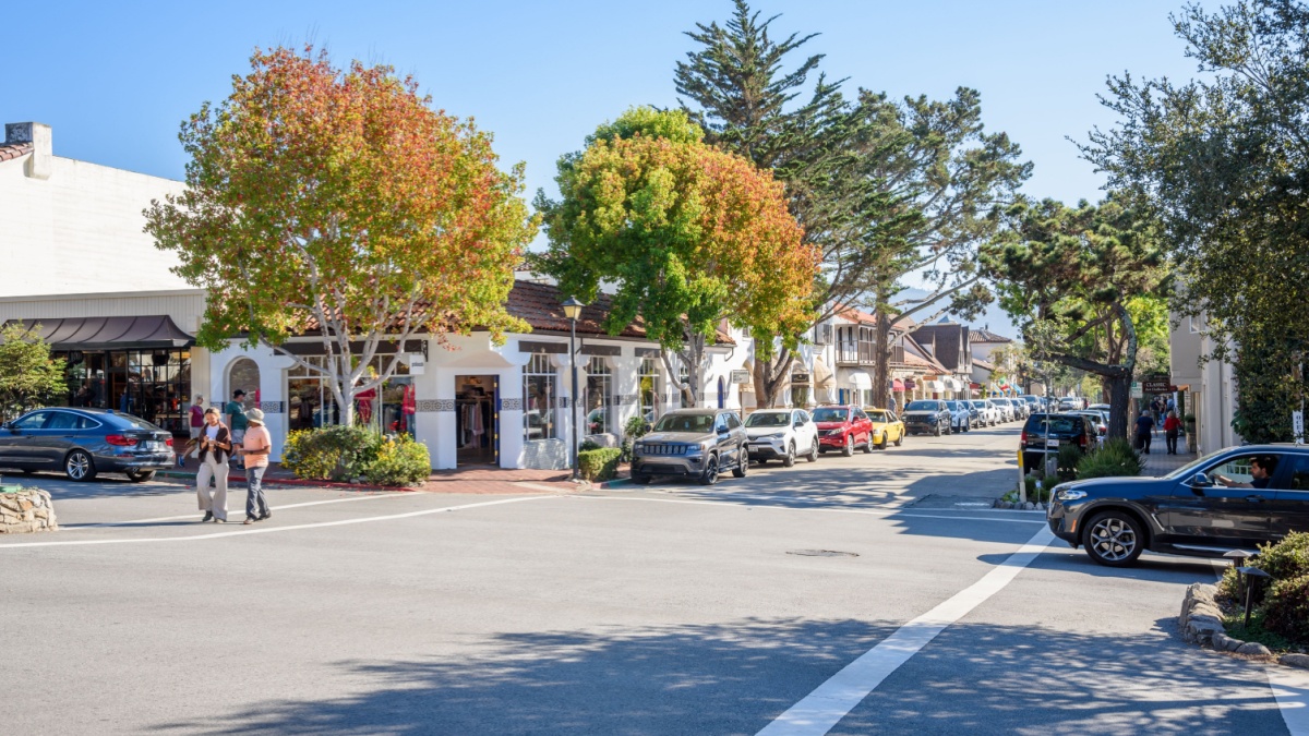 Carmel-By-The-Sea, CA - October 18, 2022: view of Ocean avenue on a clear afternoon. Ocean Avenue, downtown Carmel's main street, is lined with many shops, coffee houses, and galleries.