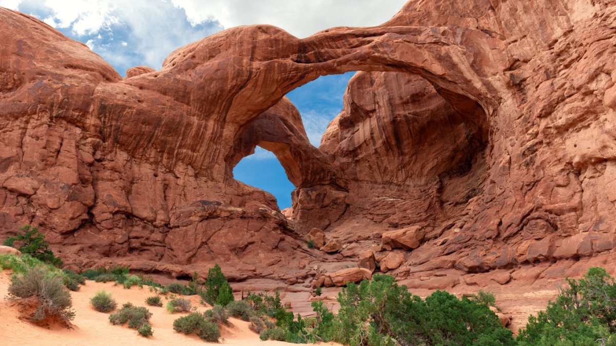 Double Arch Sandstone Rock Formation. The Windows Section Trail with Doble Arch, Natural Wonder in Arches National Park, Utah, United States.