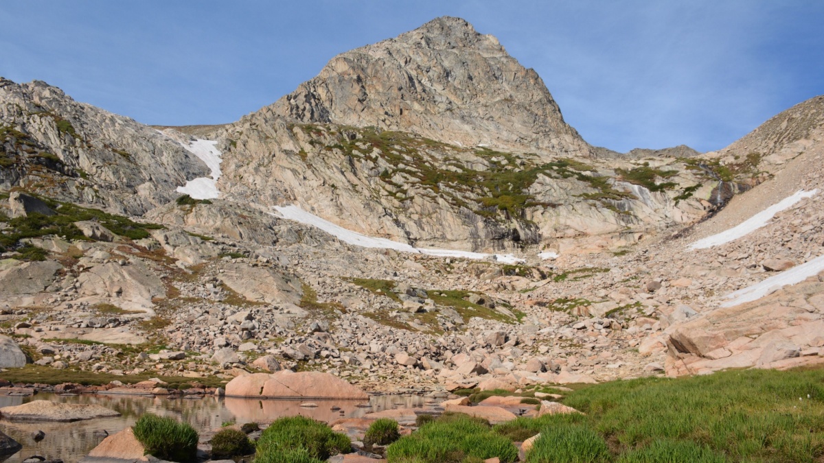 Mt Toll with Lush Alpine Grasses Rugged Landscape along Blue Lakes Trail in Indian Peaks Wilderness Brainard Lake Recreation District Ward Colorado.