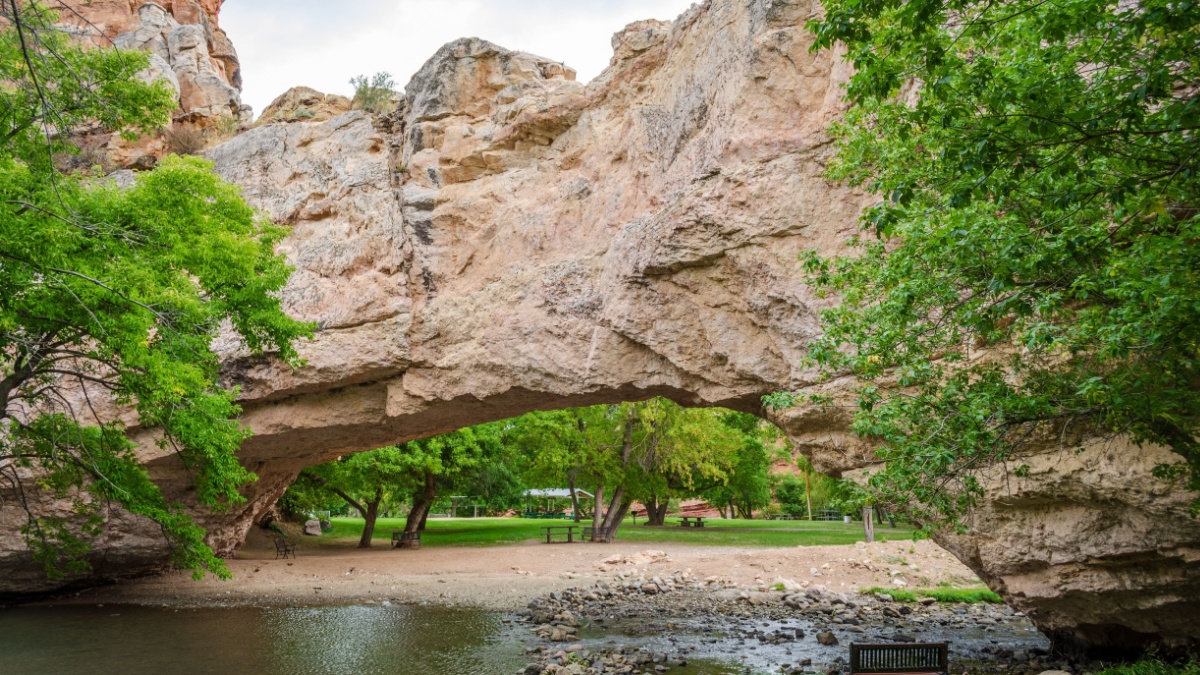 Arch and River at Ayres Natural Bridge Park in Wyoming, USA.