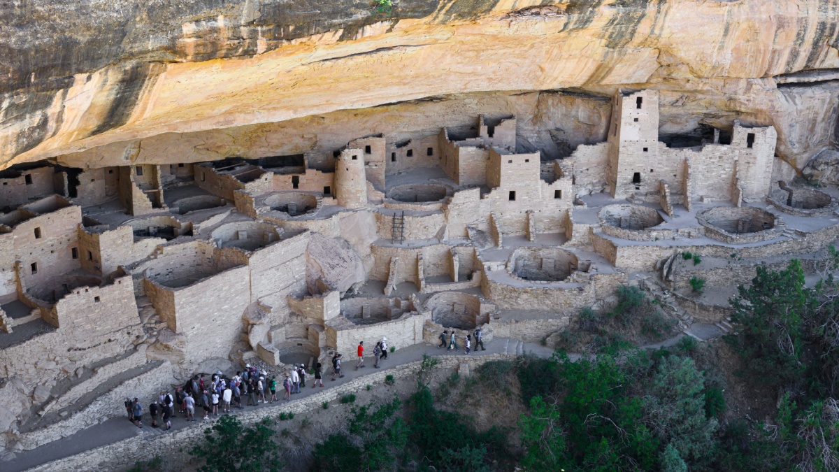 Mancos, CO, USA - June 16, 2024; Organized tour group at Cliff Palace dwelling at Mesa Verde National Park.