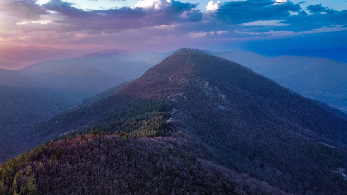 Aerial view of Hawksbill Mountain, the highest peak in Shenandoah National Park, Virginia, USA, showcasing its rugged terrain and surrounding Blue Ridge Mountains.