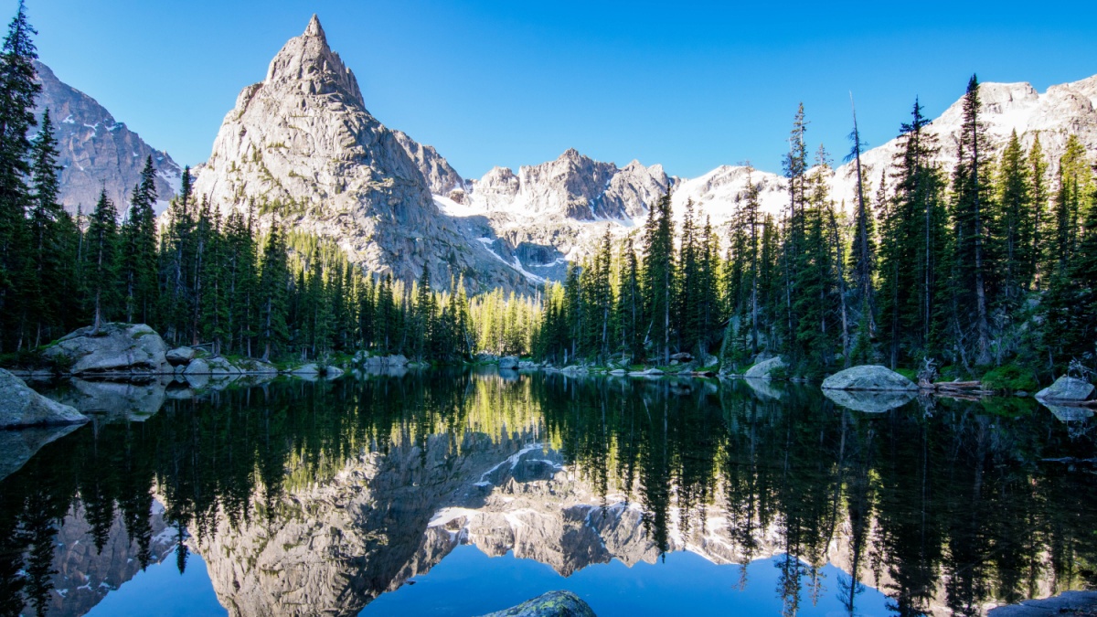 Reflection of Lone Eagle Peak in Mirror Lake in the gorgeous Indian Peaks Wilderness area of Colorado.