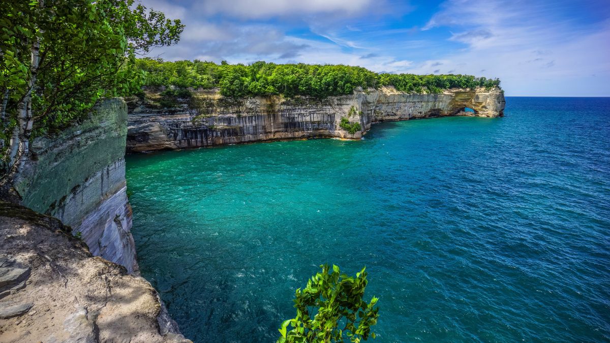 Pictured Rocks National Lakeshore - Scenic Great Lakes Shoreline Landscape - Pure Michigan Lake Superior Shoreline At Grand Portal Point - A Natural Arch In Cliffs Meet Water.