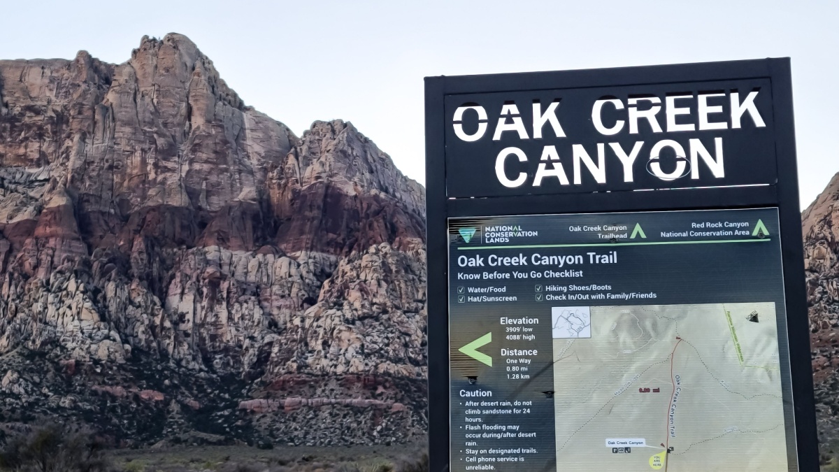 Las Vegas, Nevada USA - 11 28 2020: Oak Creek Canyon Trail sign at sunset in Red Rocks.