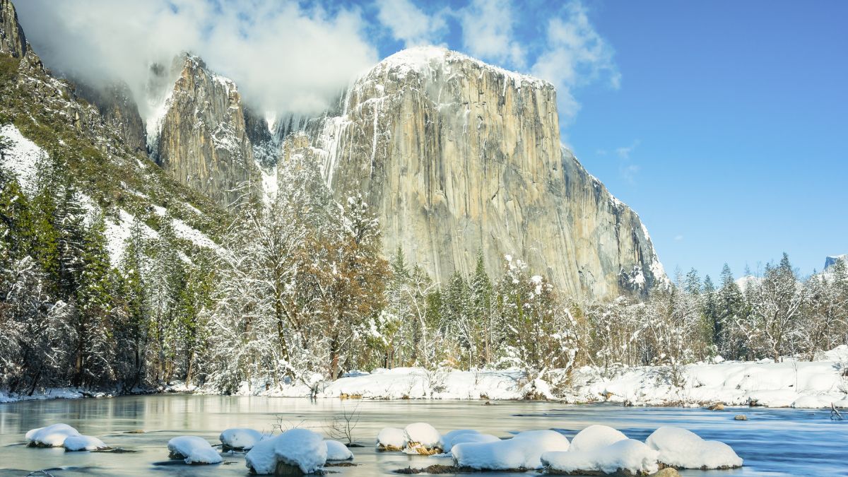 The Merced River looking into Yosemite Valley and El Capitan during the winter with snow. Yosemite National Park, California.