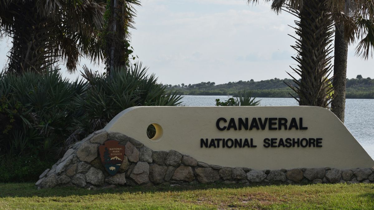 A sign designates the entrance to Canaveral National Seashore, USA.