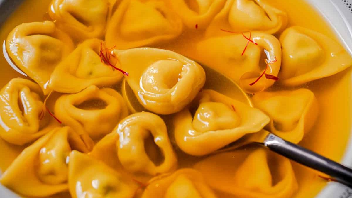 Coriander Ricotta Tortellini in Saffron Broth.