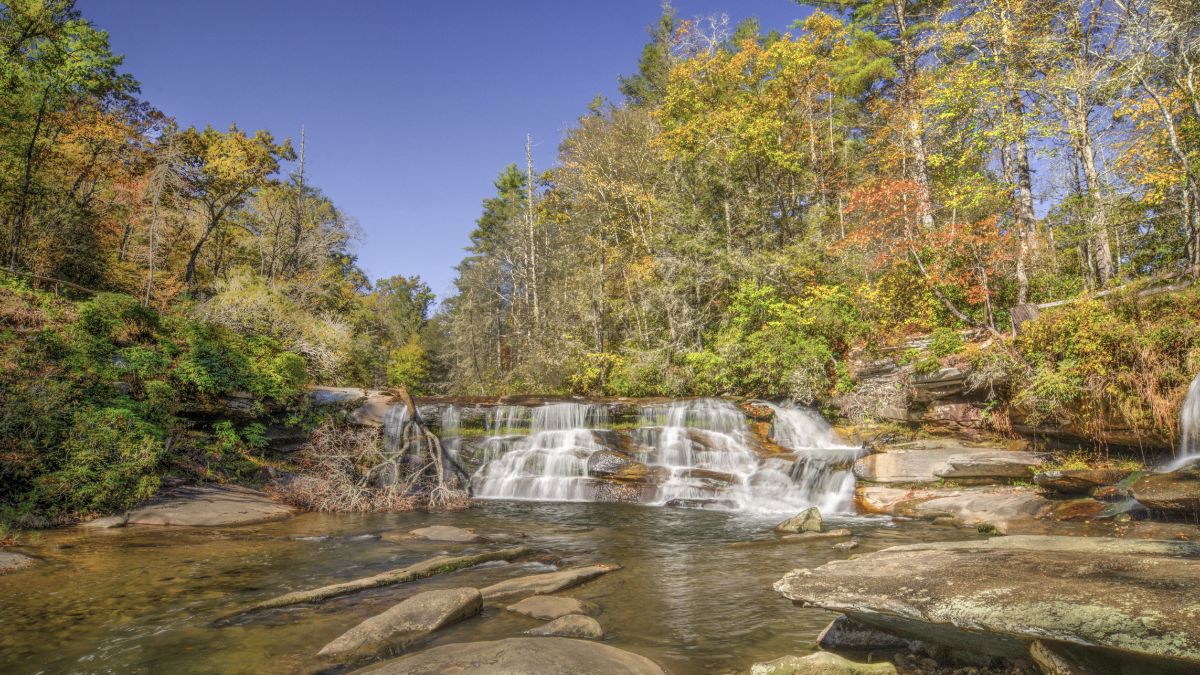 French Broad Falls. A scenic 15 foot tall waterfall also called Mill Shoals Falls. Located behind the Living Waters Ministry in North Carolina.