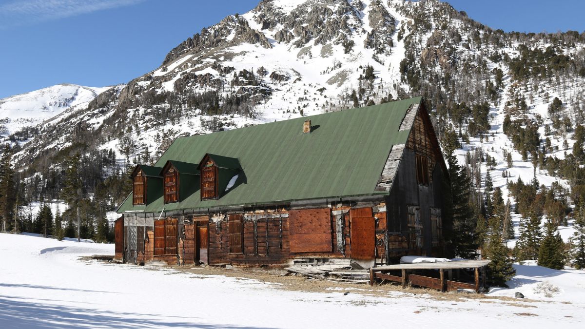 Ghost town of Kirwin, Wyoming with mountain in background.