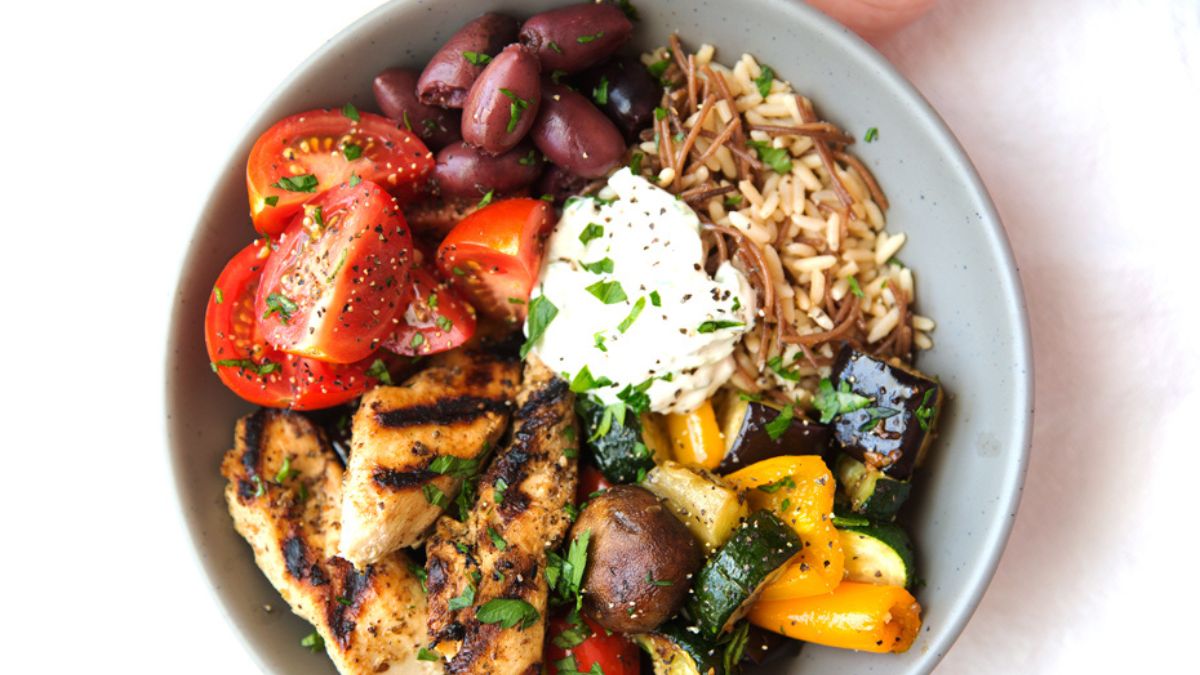 Greek Chicken Souvlaki Bowls with Roasted Veggies and Tzatziki Sauce.