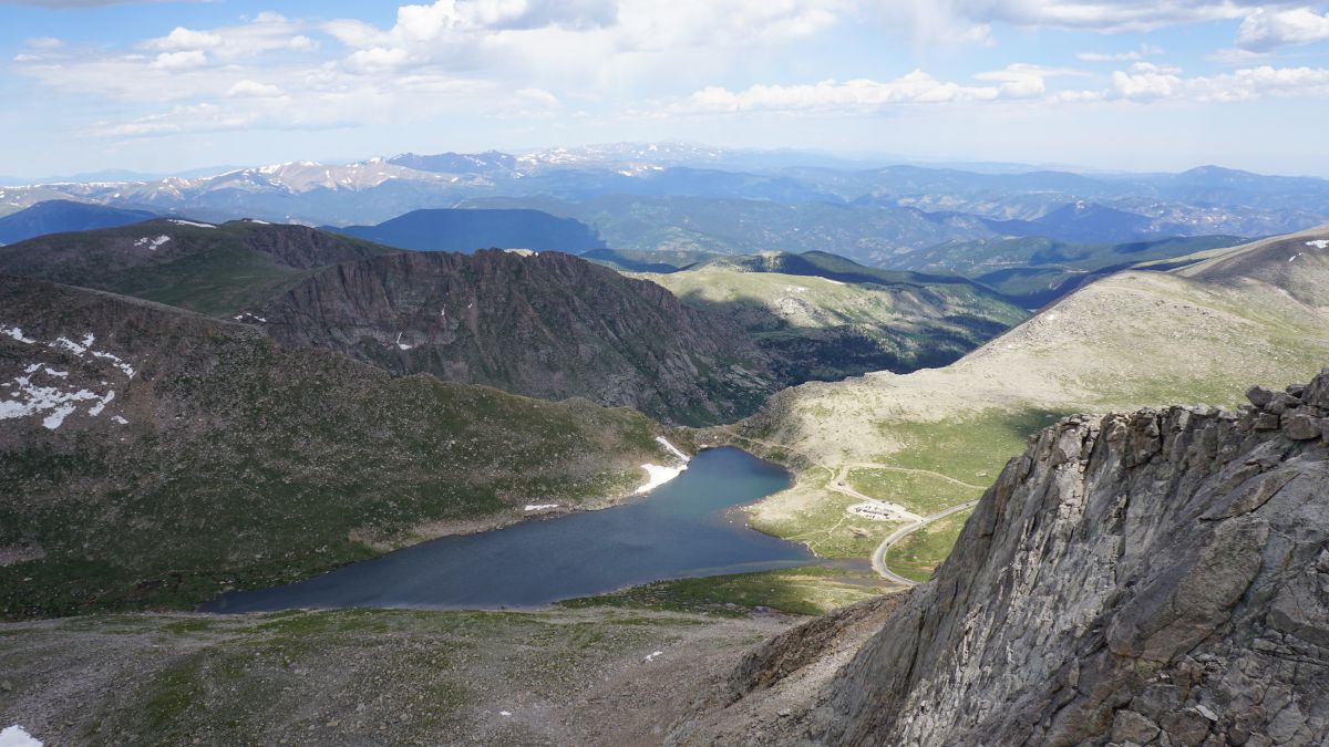 Mt. Evans, the 27th tallest mountain in America at 14,271 ft, in Idaho Springs, Colorado. Picture taken at the very peak of the mountain looking over Echo Lake through the valley.