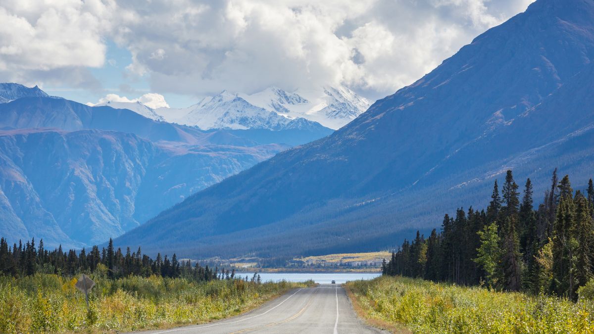 Scenic highway in Alaska, USA. Dramatic view clouds.