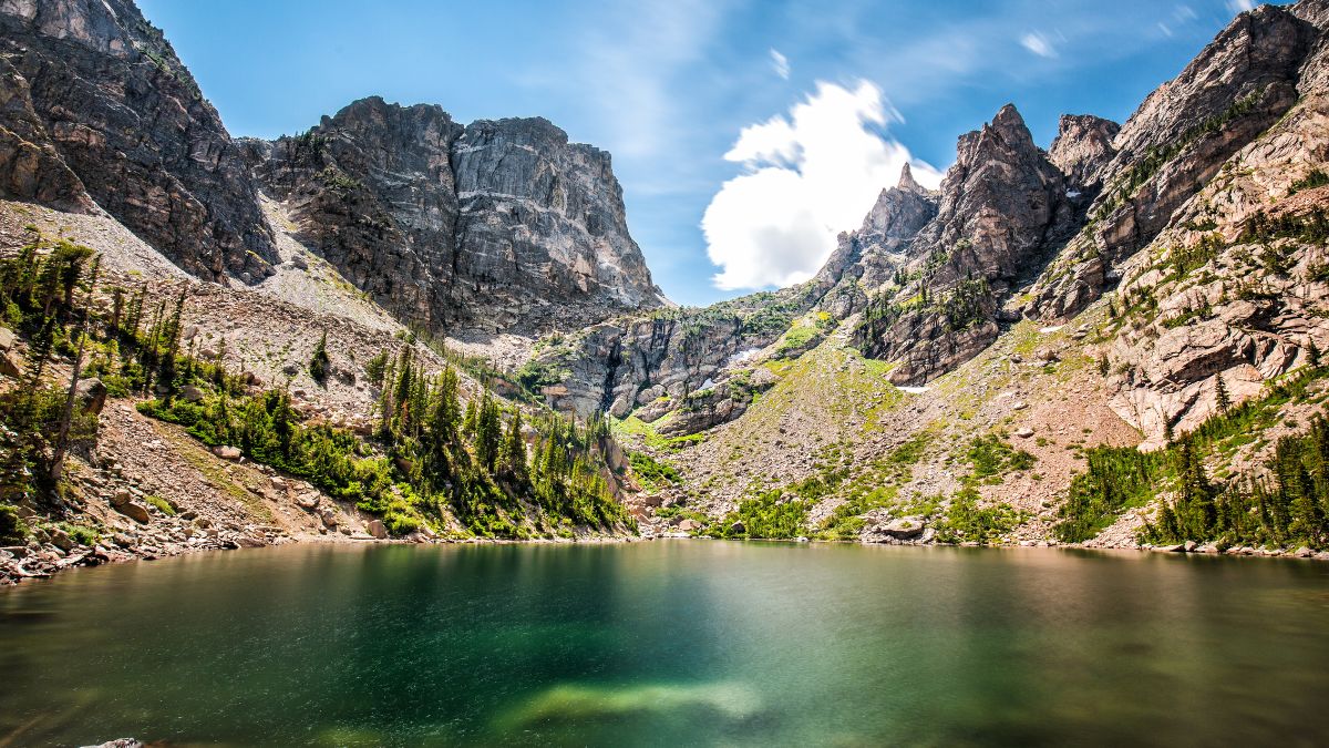 Beautiful Emerald Lake in Rocky Mountains, Colorado, Hallett Peak and Flattop Mountain in the background and some green trees.