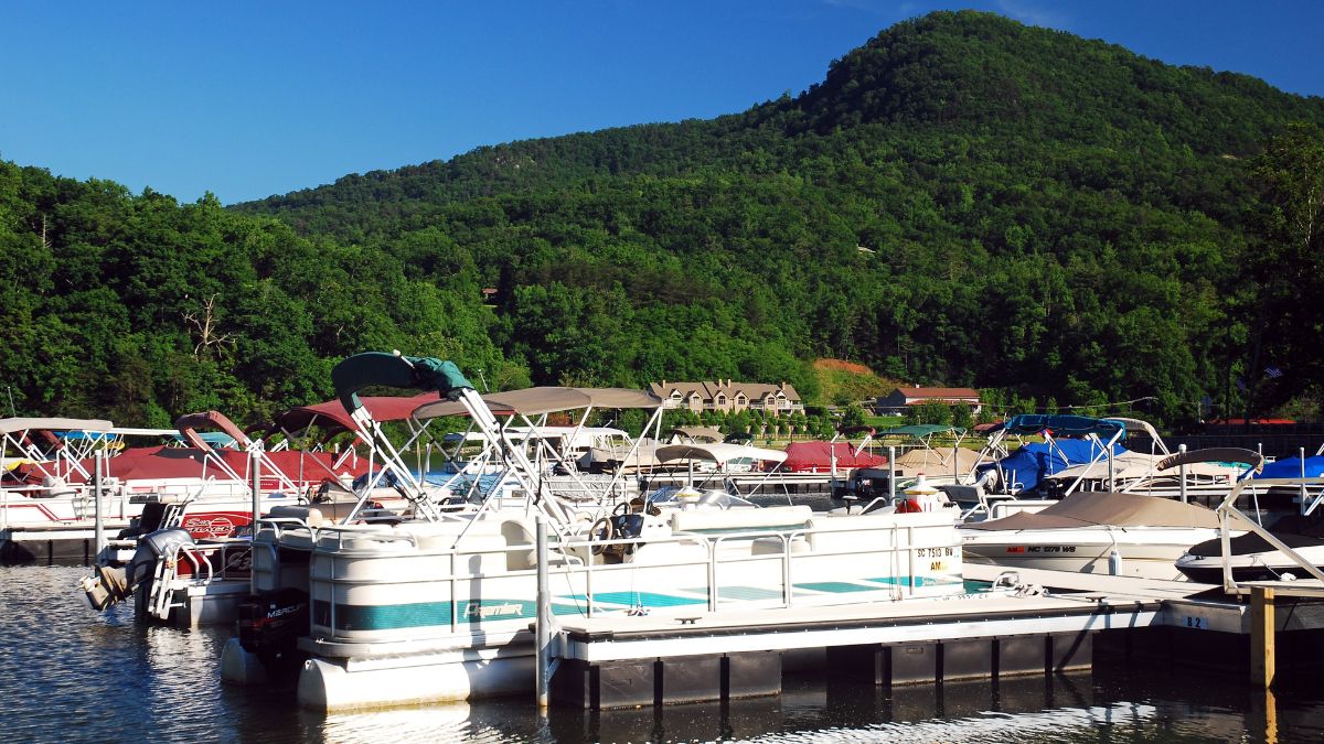 Lake Lure, NC, USA May 29, 2013 Recreational boats are moored at a small marina in a forest park in Lake Lure, North Carolina.