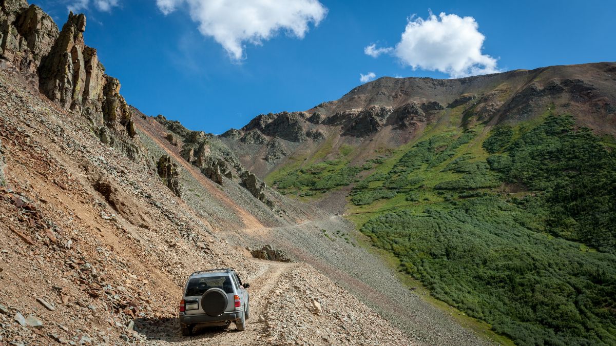 SUV at County Rd 8, Ophir Pass, From Silverton to Telluride, CO, USA.
