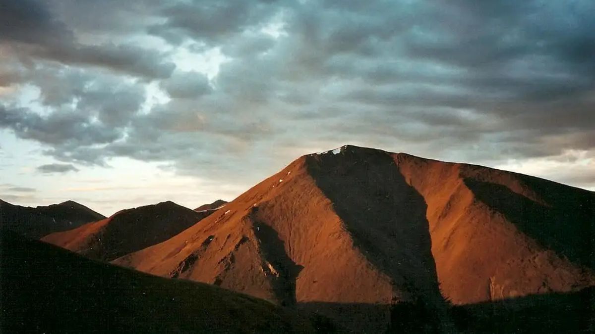 San Luis Peak's west side from the Continental Divide above Creede, sunset-- July 2004 La Garita Wilderness; San Juan Mountains, Colorado.