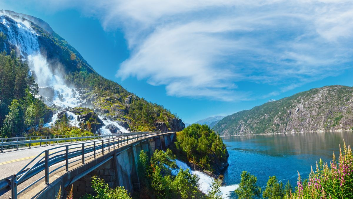 Summer mountain Langfossen waterfall on slope (Etne, Norway).