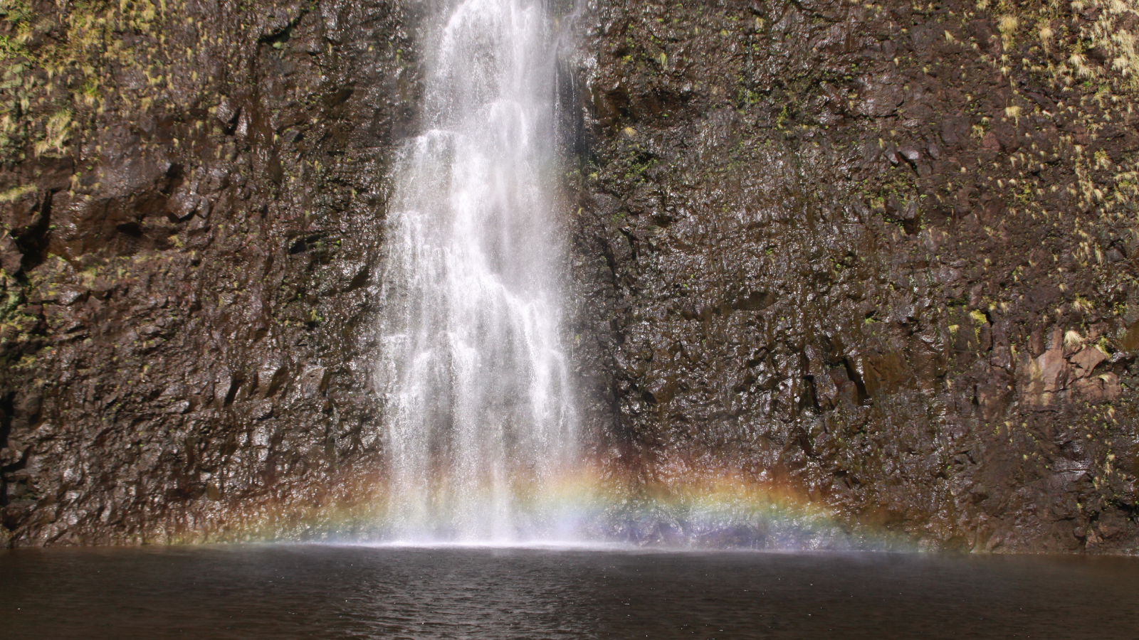 Waiâ??ilikahi Falls, with its enormous swimming pool and rainbow, Waimanu Valley ,Big Island ,Hawaii.