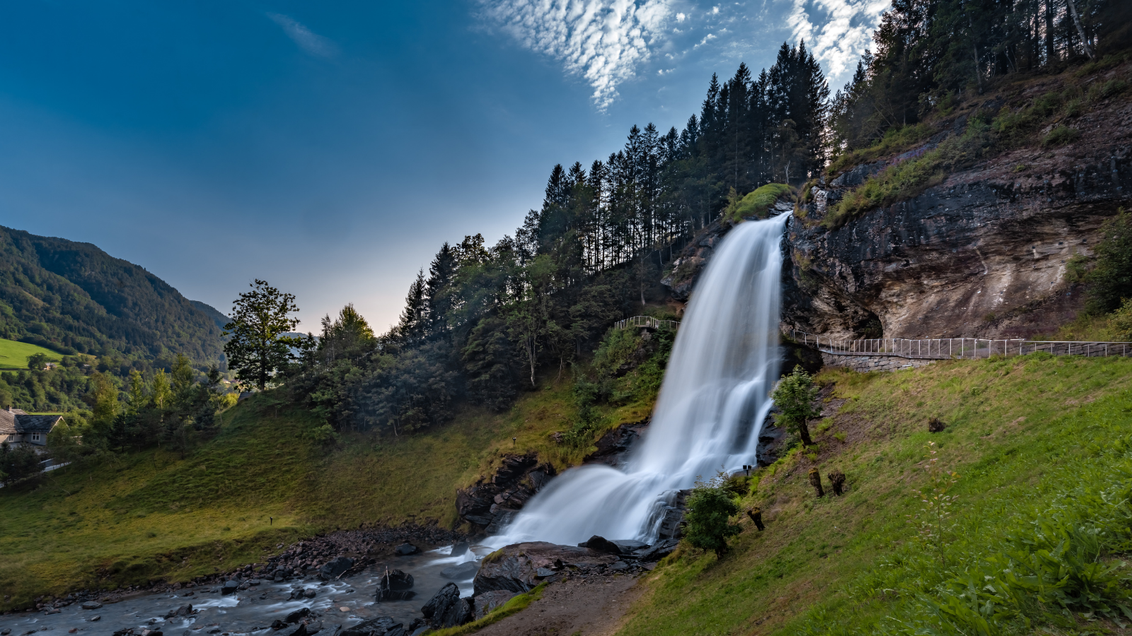 Steinsdalsfossen (also called ovsthusfossen or ofsthusfossen) waterfall in the village of Steine, Kvam, Vestland, Norway. Emperor Wilhelm II visited it every summer until the start of World War I..