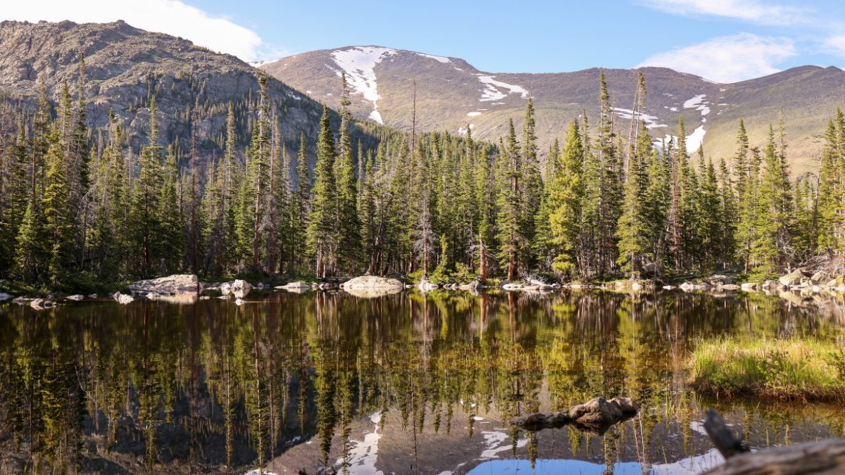 View of the Ypsilon Lake in front of the Ypsilon and Fairchild Mountains in Rocky Mountain National Park of Colorado.