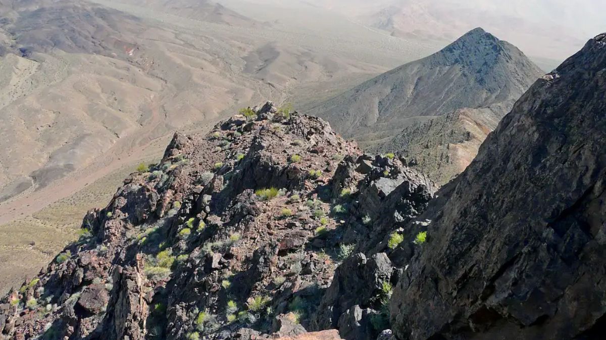 East butte from descent of main butte as storm closes in.