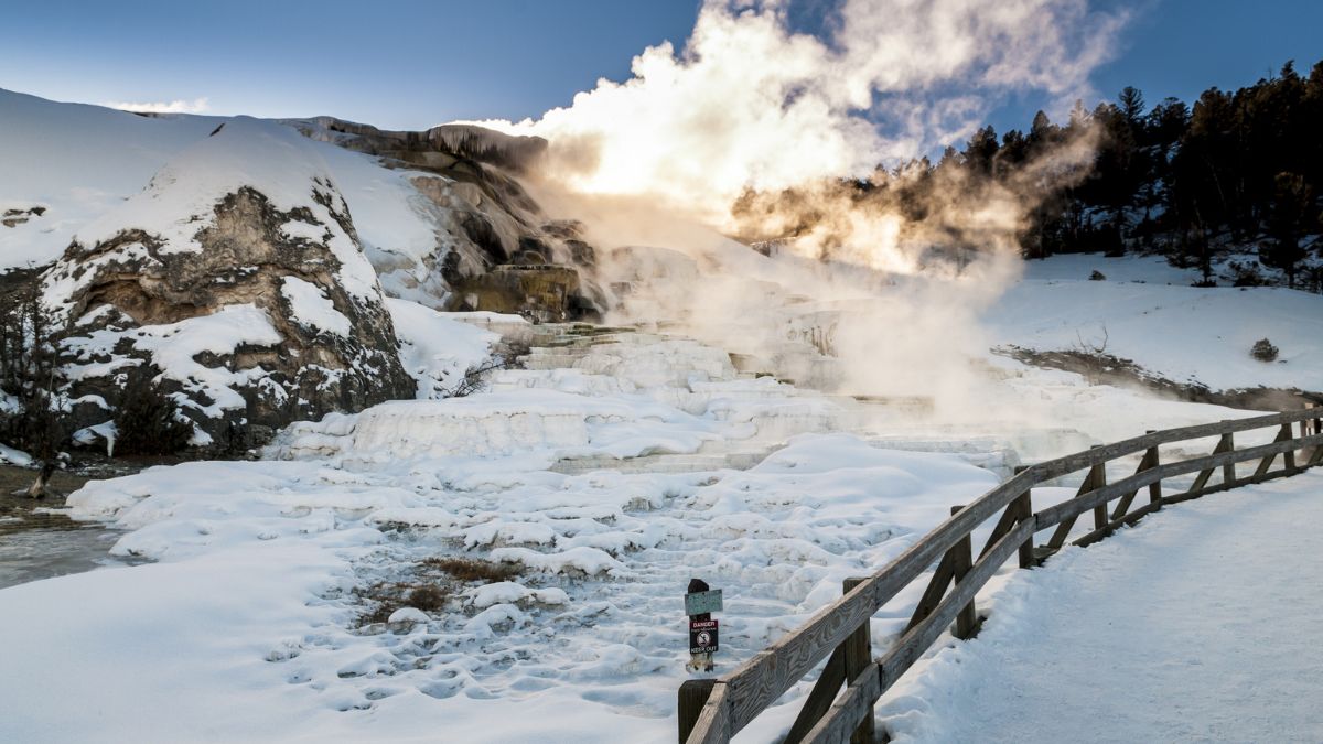Hot steaming water beautiful cascade geyser - winter landscape in Yellowstone National Park