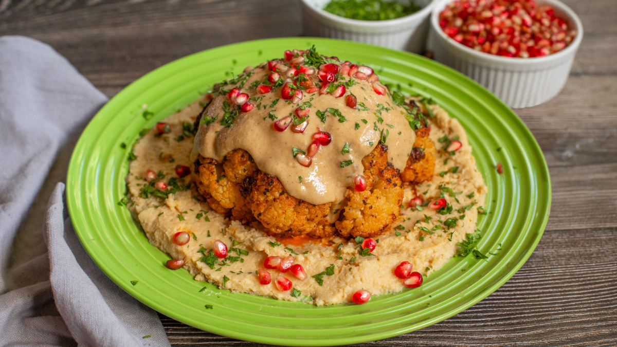 Whole Roasted Cauliflower With Tahini Sauce and Pomegranate Seeds
